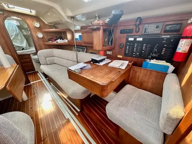 Slide: The Image of Interior of 1993 Hunter Legend 40.5 sailboat with wood finish and seating area. - 19