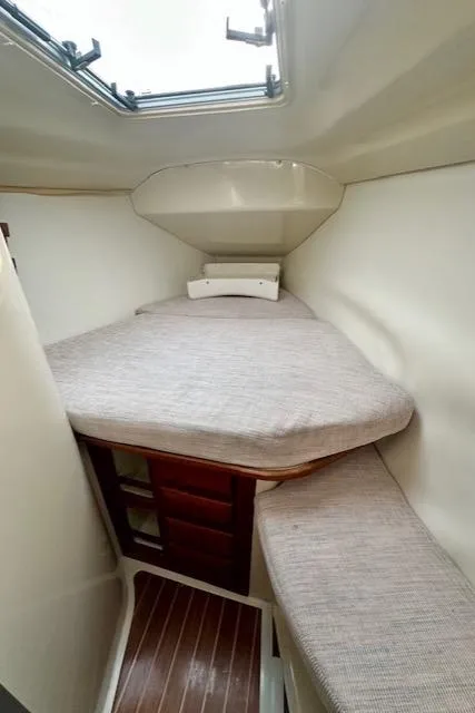 Slide: The Image of 1993 Hunter Legend 40.5 yacht cabin interior with bed and wooden flooring. - 26