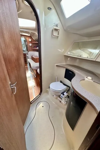 Slide: The Image of 1993 Hunter Legend 40.5 yacht bathroom with modern fixtures and wooden accents. - 28