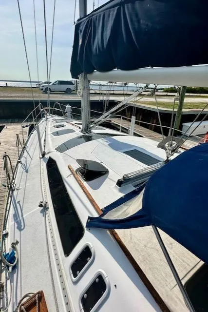 Slide: The Image of 1993 Hunter Legend 40.5 sailboat docked, showcasing deck and rigging details. - 31