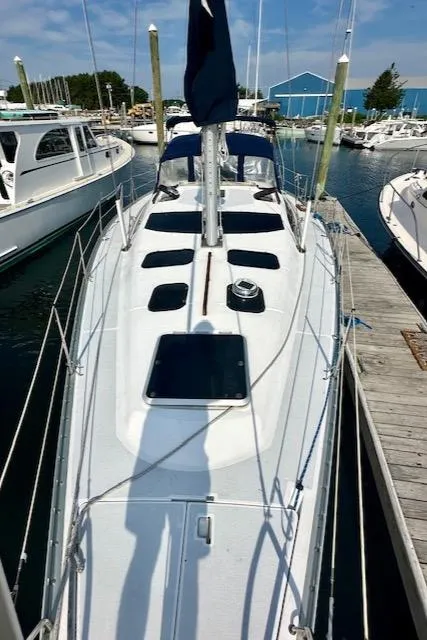 Slide: The Image of 1993 Hunter Legend 40.5 sailboat docked at a marina, viewed from above. - 33