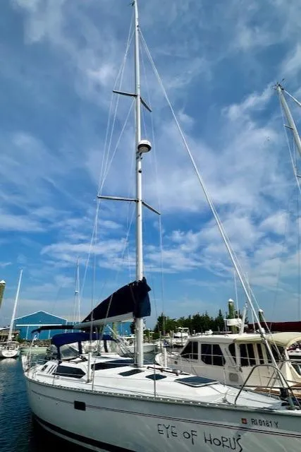 Slide: The Image of Sailboat "Eye of Horus," 1993 Hunter Legend 40.5, docked under a clear blue sky. - 34