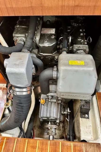 Slide: The Image of Engine compartment of a 1993 Hunter Legend 40.5 sailboat, showcasing mechanical components. - 37