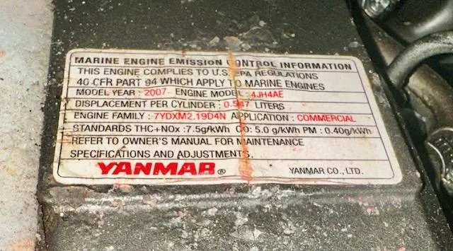 Slide: The Image of Marine engine emission label on Yanmar engine, model 4JH4E, 2007, for Hunter Legend 40.5, 1993. - 38