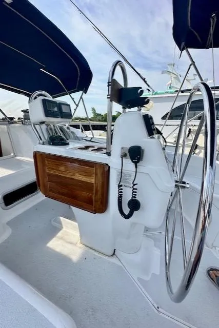 Slide: The Image of 1993 Hunter Legend 40.5 sailboat cockpit with dual steering wheels and navigation equipment. - 4