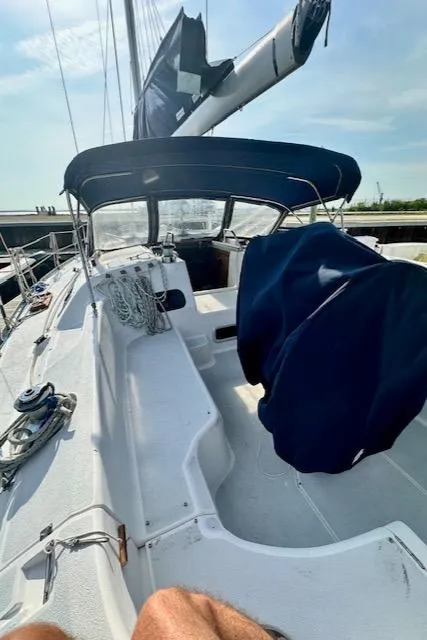 Slide: The Image of 1993 Hunter Legend 40.5 sailboat deck with blue covers and rigging. - 5