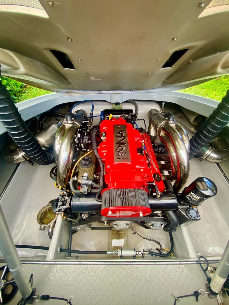 Slide: The Image of 2008 Porsche Fearless 28 engine with red cover and chrome components. - 11