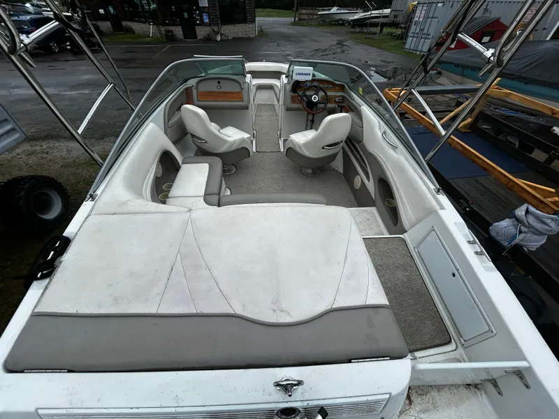 Slide: The Image of 2001 Cobalt 226 boat interior with seating and steering wheel. - 11