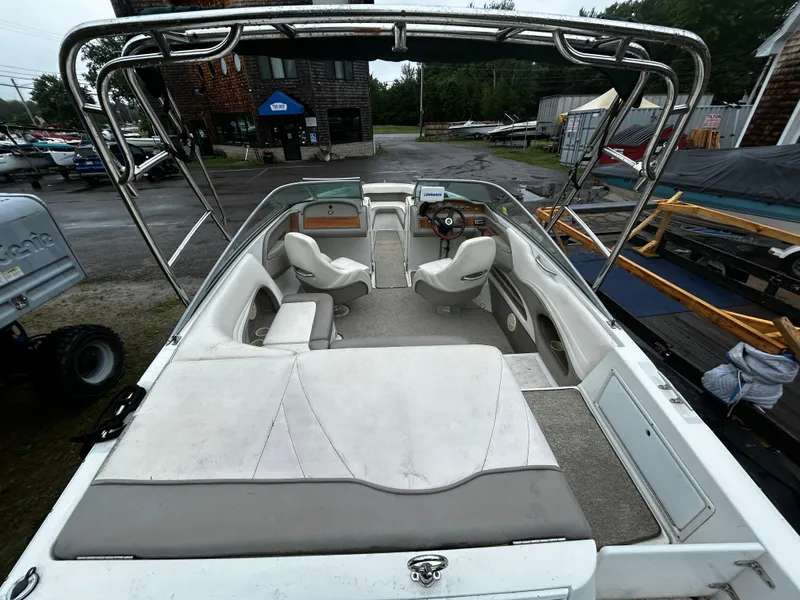 Slide: The Image of 2001 Cobalt 226 boat interior with seating and steering wheel. - 12