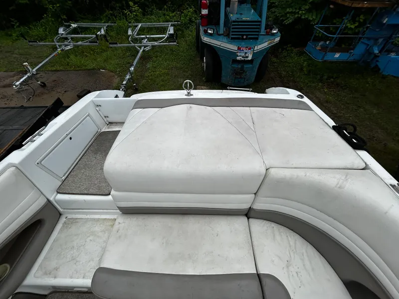 Slide: The Image of 2001 Cobalt 226 boat interior with white and gray seating. - 13