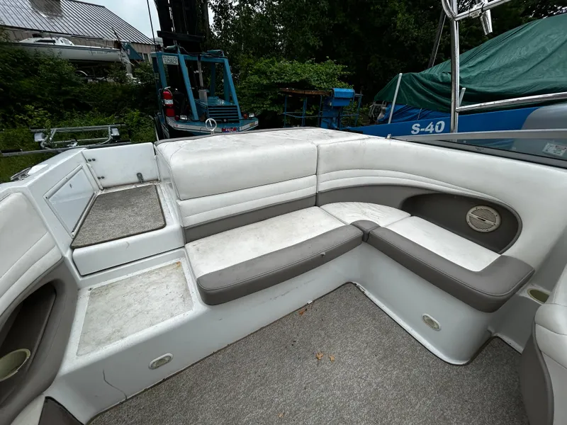 Slide: The Image of 2001 Cobalt 226 boat interior with white and gray seating. - 17