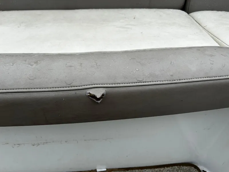 Slide: The Image of Damaged seat upholstery on a 2001 Cobalt 226 boat. - 19