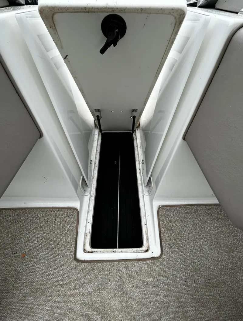 Slide: The Image of Open storage compartment in a 2001 Cobalt 226 boat. - 30