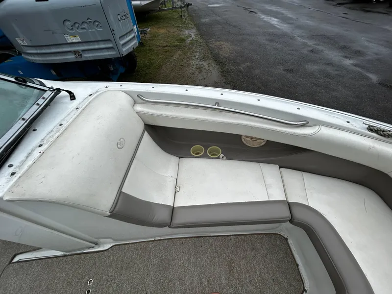 Slide: The Image of 2001 Cobalt 226 boat interior seating with cup holders. - 32