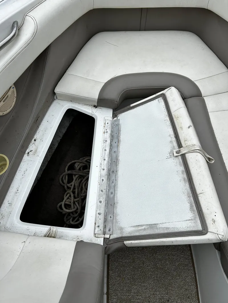 Slide: The Image of Open storage compartment on a 2001 Cobalt 226 boat. - 33