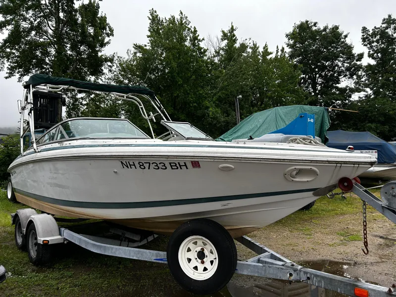 Slide: The Image of 2001 Cobalt 226 boat on a trailer, NH 8733 BH, parked outdoors. - 5