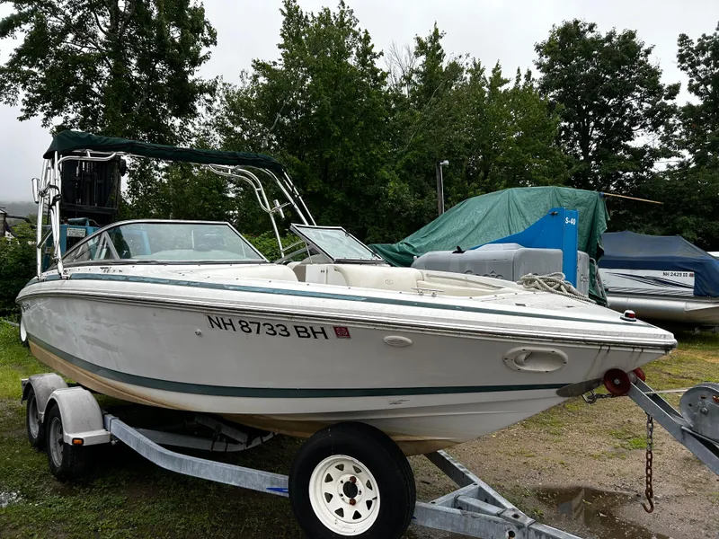 Slide: The Image of 2001 Cobalt 226 boat on trailer, parked outdoors. - 6