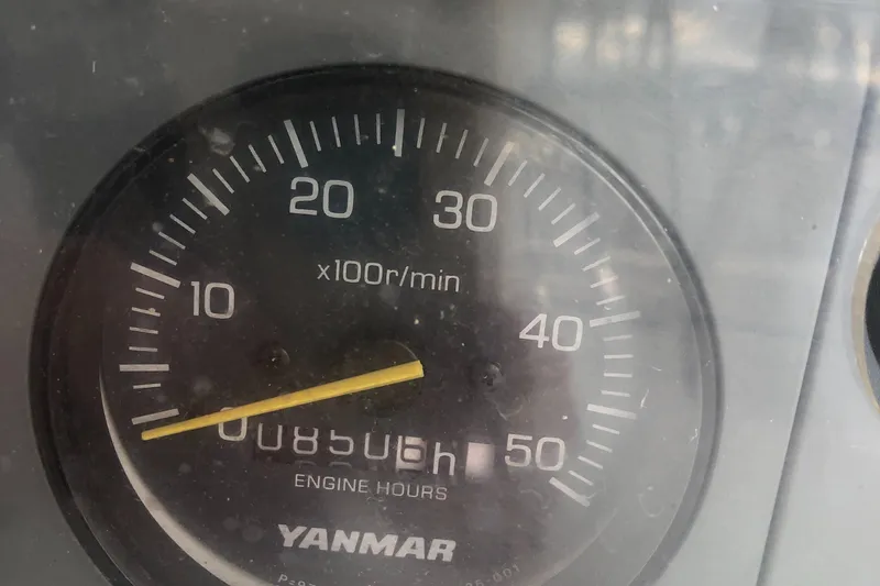 Slide: The Image of Tachometer of 2004 Hunter 33, showing 8506 engine hours, Yanmar branding. - 15