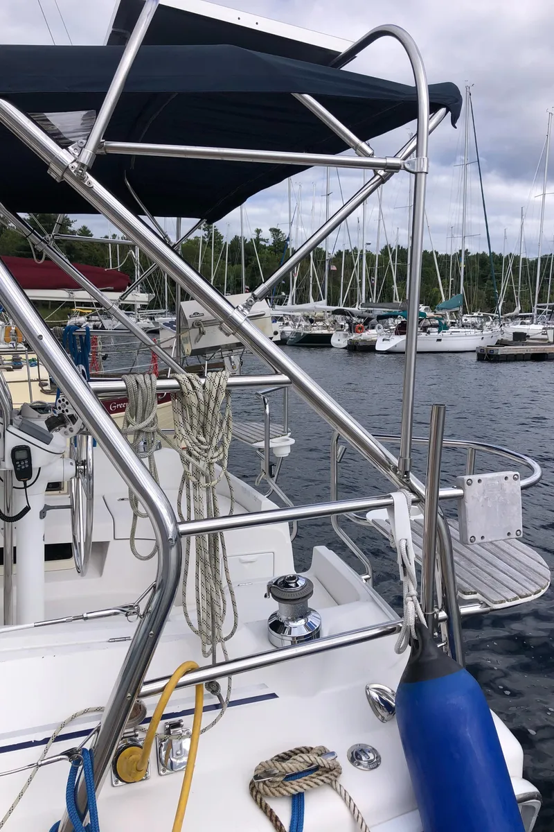 Slide: The Image of Sailboat deck with ropes and fenders, Hunter 33 model, 2004, docked in marina. - 8