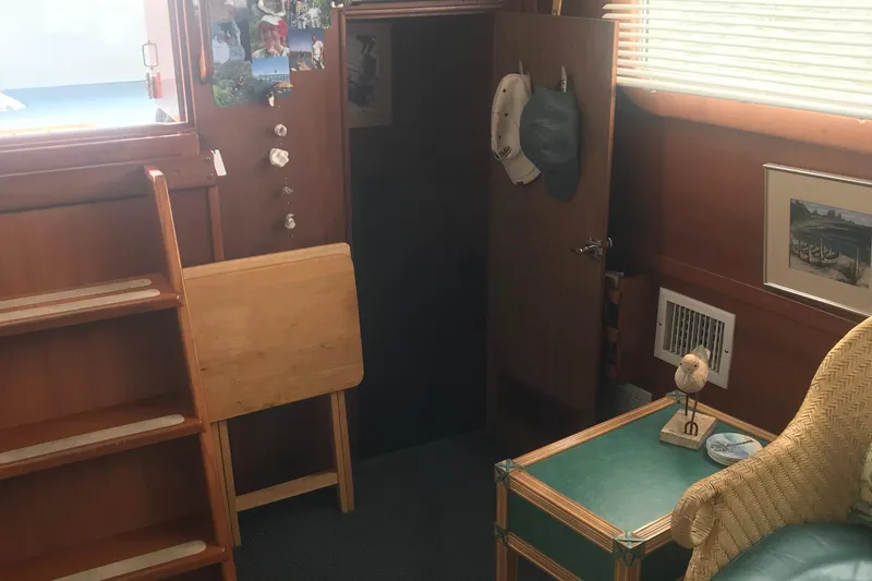 Slide: The Image of Cozy interior of 1984 Custom 43 Steady Sailor with wooden decor and nautical accents. - 18