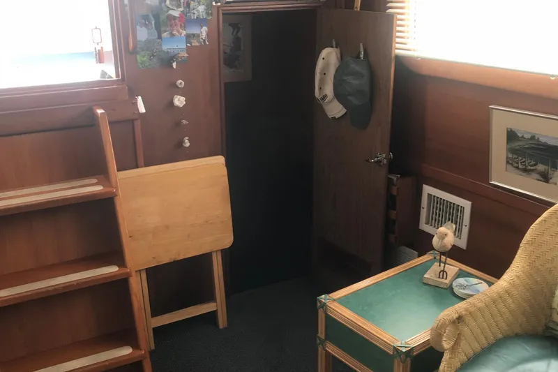 Slide: The Image of Cozy interior of 1984 Custom 43 Steady Sailor with wooden decor and nautical accents. - 20