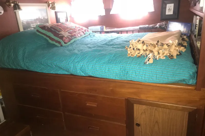 Slide: The Image of Cozy cabin bed with turquoise bedding in 1984 Custom 43 Steady Sailor yacht. - 25