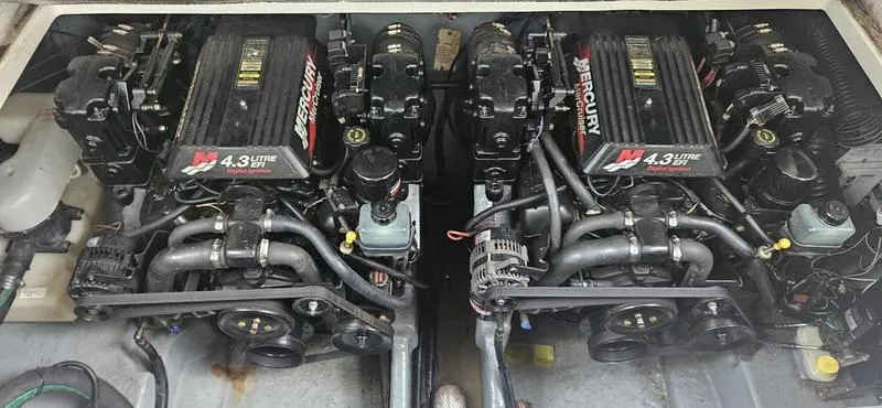 Slide: The Image of Twin MerCruiser engines in a 2001 Sea Ray Sundancer 280 boat. - 13