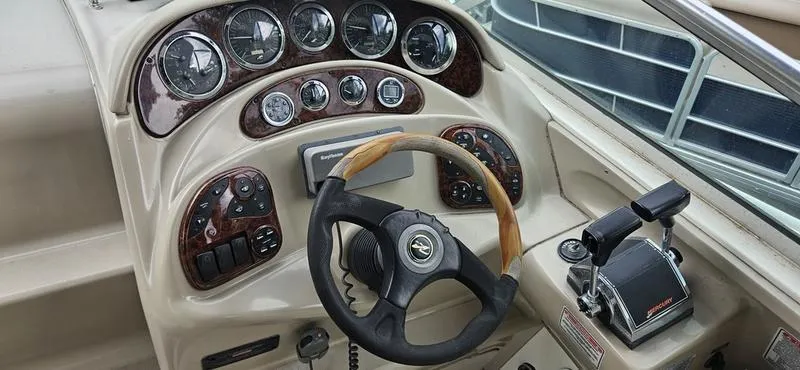 Slide: The Image of 2001 Sea Ray Sundancer 280 helm with steering wheel and control panel. - 4