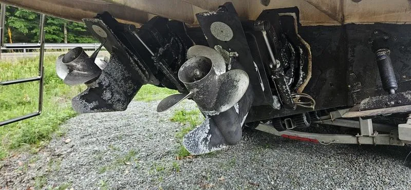 Slide: The Image of 2001 Sea Ray Sundancer 280 boat propellers and outdrives with marine growth. - 6