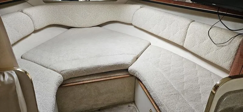 Slide: The Image of 2001 Sea Ray Sundancer 280 cabin interior with cushioned seating. - 7