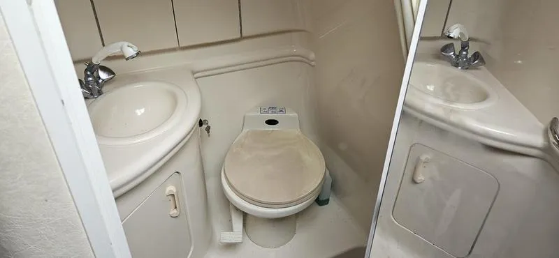 Slide: The Image of 2001 Sea Ray Sundancer 280 boat bathroom with sink and toilet - 8