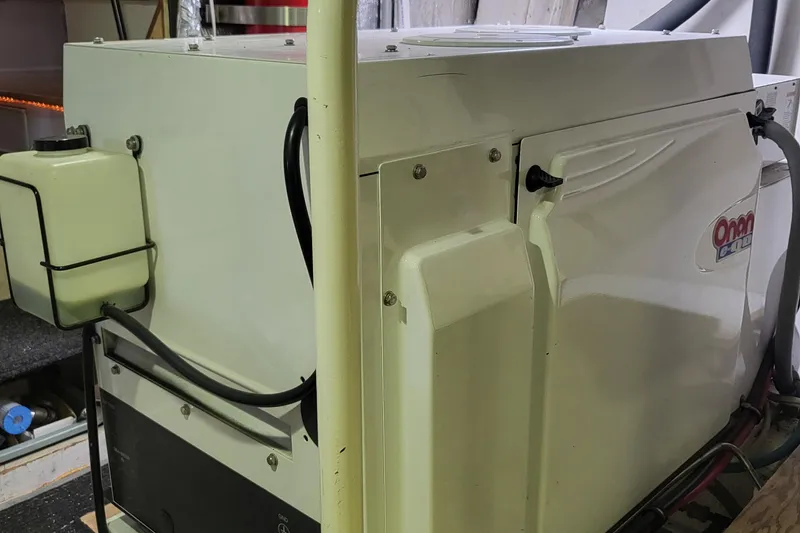 Slide: The Image of 1970 Chris-Craft Commander engine room with Onan generator. - 23