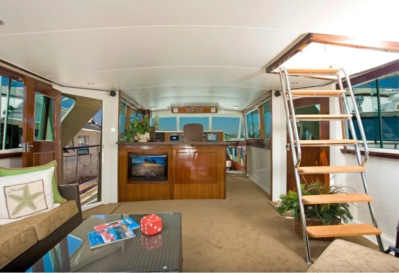 Slide: The Image of 1970 Chris-Craft Commander yacht interior with modern decor and wooden accents. - 4