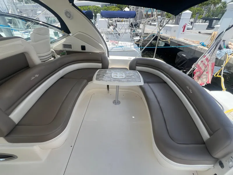 Slide: The Image of 2005 Sea Ray 420 Sundancer yacht interior with curved seating and table. - 10