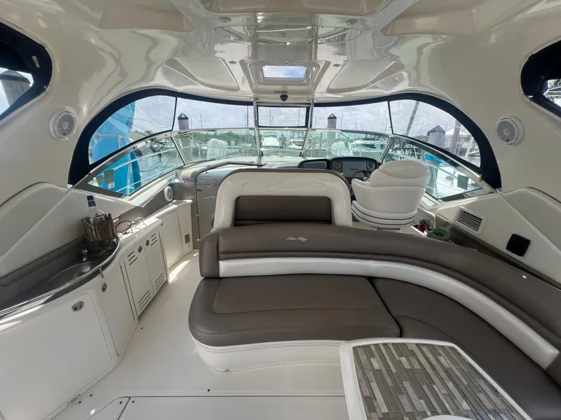 Slide: The Image of Luxurious interior of 2005 Sea Ray 420 Sundancer yacht with plush seating and helm. - 14