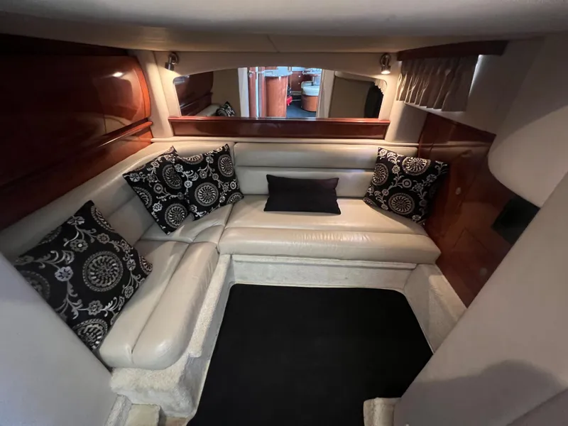 Slide: The Image of Luxurious interior of 2005 Sea Ray 420 Sundancer with elegant seating and decorative pillows. - 29