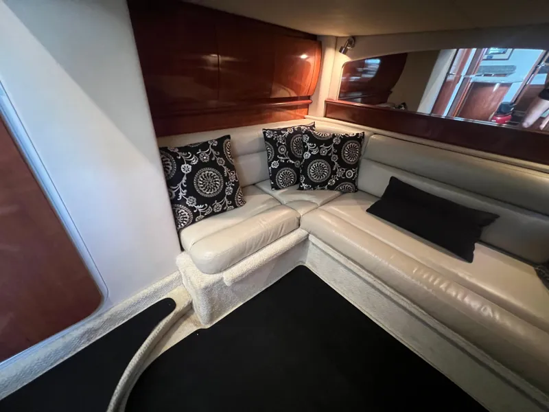 Slide: The Image of Luxurious 2005 Sea Ray 420 Sundancer interior with elegant leather seating and decorative pillows. - 31