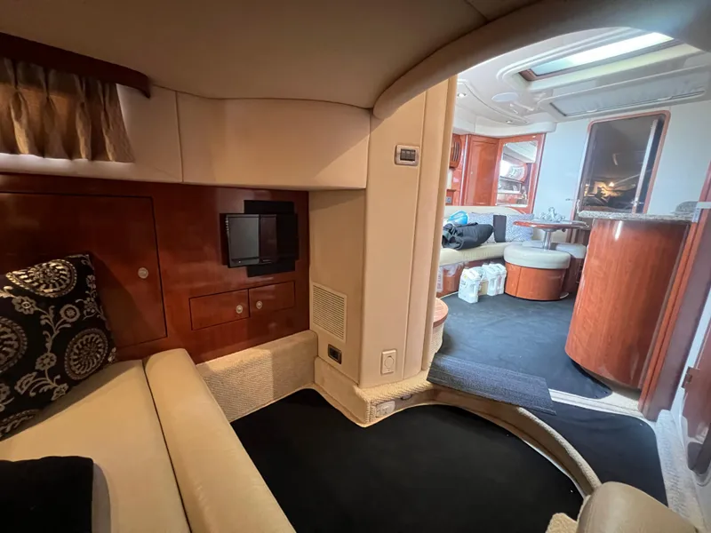 Slide: The Image of Luxurious interior of 2005 Sea Ray 420 Sundancer yacht with elegant seating and wood finishes. - 32