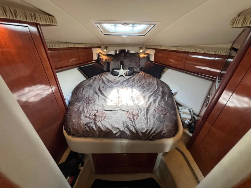 Slide: The Image of Luxurious cabin interior of 2005 Sea Ray 420 Sundancer yacht with elegant bedding. - 36