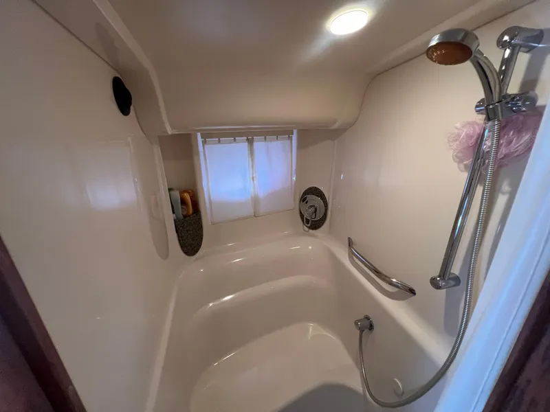 Slide: The Image of Bathroom interior of 2005 Sea Ray 420 Sundancer yacht with shower and window. - 37