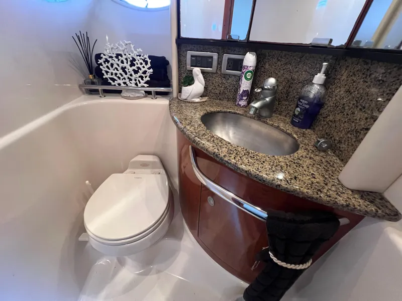 Slide: The Image of Luxurious bathroom in 2005 Sea Ray 420 Sundancer yacht with granite countertop and modern fixtures. - 41