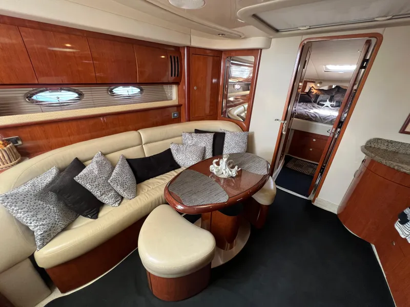 Slide: The Image of Luxurious interior of 2005 Sea Ray 420 Sundancer yacht with elegant seating and decor. - 48