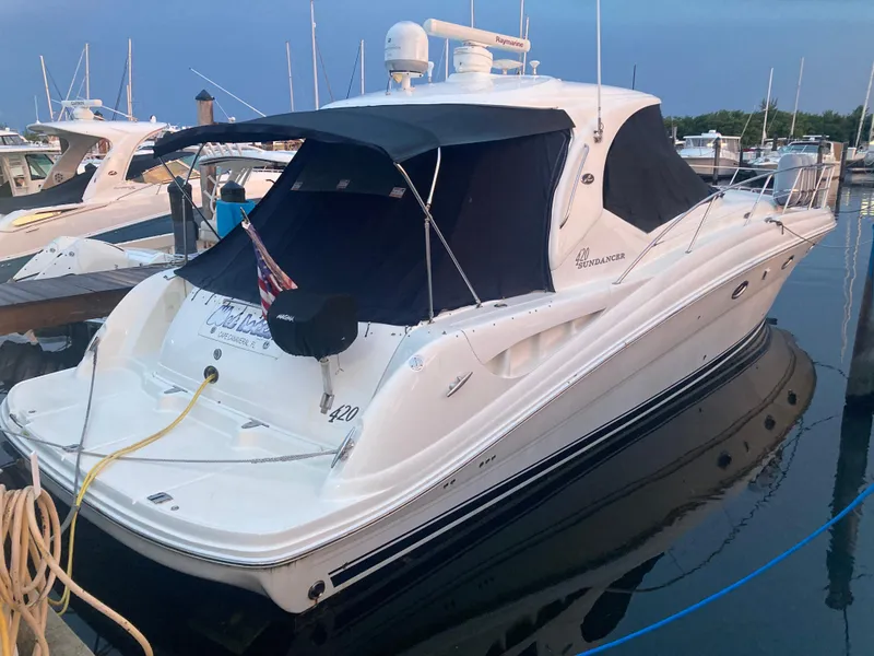 Slide: The Image of 2005 Sea Ray 420 Sundancer yacht docked at marina. - 58