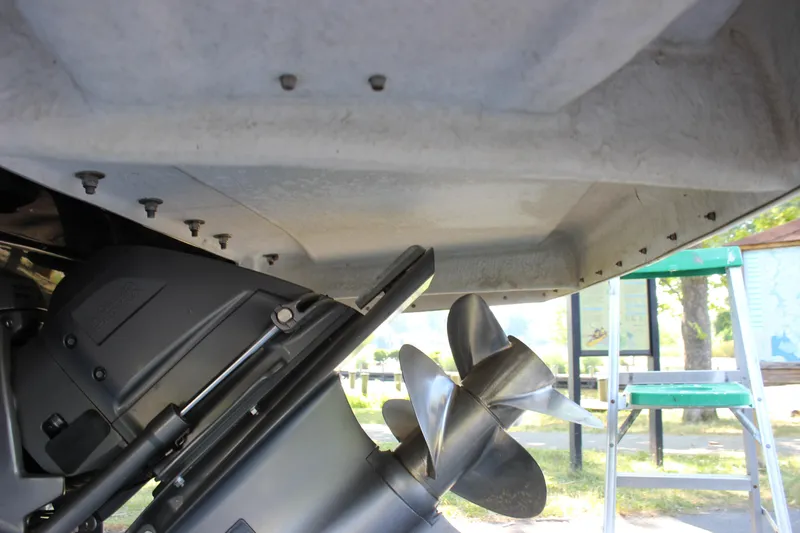 Slide: The Image of Close-up of the propeller and stern drive of a 2016 Regal 2500 Bowrider boat. - 34