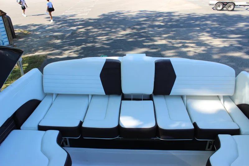 Slide: The Image of 2016 Regal 2500 Bowrider boat with spacious white and black seating. - 36