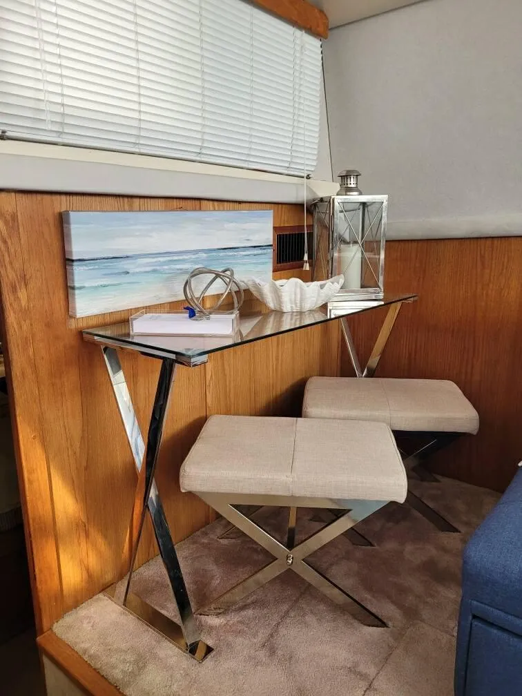 Slide: The Image of 1989 Silverton 40 Aft Cabin interior with modern decor and seating area. - 27