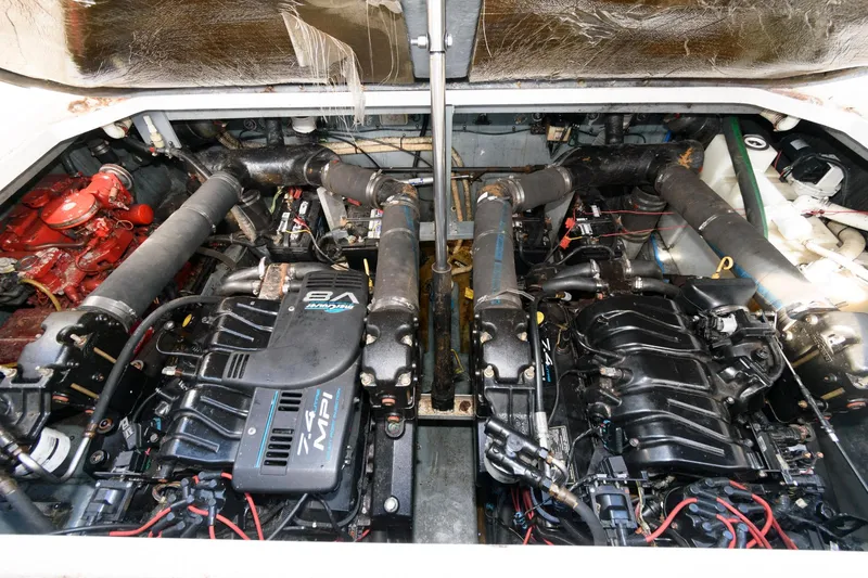 Slide: The Image of Engine compartment of a 1999 Sea Ray 340 Sundancer boat with twin engines. - 15