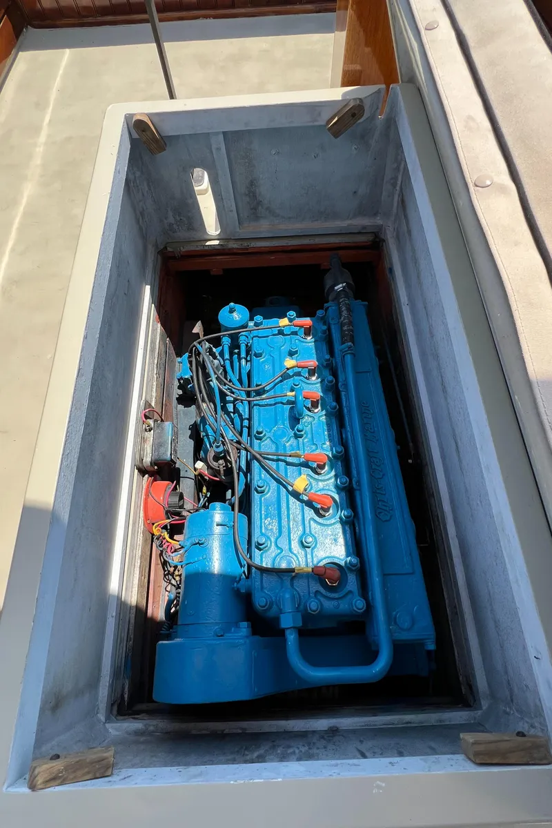 Slide: The Image of 1952 Custom Palmer Scott 22 engine, blue, in a boat compartment. - 18