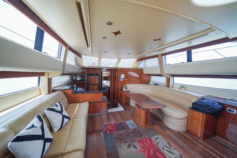 Slide: The Image of Luxurious interior of a 2007 Meridian 459 Motor Yacht with leather seating and wooden finishes. - 2