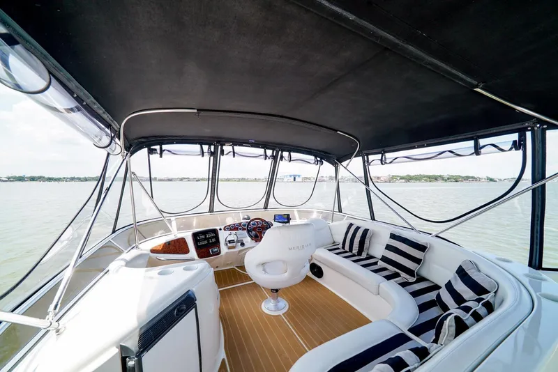 Slide: The Image of 2007 Meridian 459 Motor Yacht interior with helm and seating area. - 25